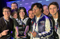 UW-Stout game design alumni celebrate their winning game, Dread Not, at November's M+DEV game conference in Madison. (Submitted photo)