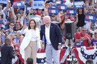 Democratic presidential nominee Vice President Kamala Harris is welcomed by Democratic vice presidential nominee Minnesota Gov. Tim Walz, before she delivers remarks at a campaign event, Wednesday, Aug. 7, 2024, in Eau Claire, Wisc. (AP Photo/Charles Rex Arbogast)