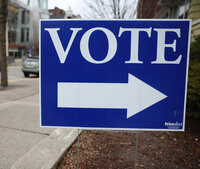 A sign directs voters outside a polling place near the University of Wisconsin-Madison campus on April 4, 2023. (Drake White-Bergey / Wisconsin Watch)