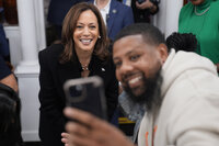 Democratic presidential nominee Vice President Kamala Harris takes a selfie with a patron at a campaign stop at Famous 4th Street Delicatessen in Philadelphia, Wednesday, Oct. 23, 2024. (AP Photo/Matt Rourke)