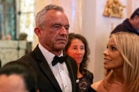 Robert F. Kennedy Jr., and his wife Cheryl Hines arrive before President-elect Donald Trump speaks during an America First Policy Institute gala at his Mar-a-Lago estate, Thursday, Nov. 14, 2024, in Palm Beach, Fla. (AP Photo/Alex Brandon)