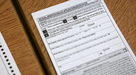 An absentee ballot envelope for the Nov. 8, 2022, election is seen at the village of Ephraim administration building in Door County, Wis., on Oct. 25, 2022. (Coburn Dukehart / Wisconsin Watch)