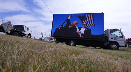 An electronic billboard displays images of former President Donald Trump from his recent rally at the Butler Farm Show, Thursday, July 18, 2024, in Butler, Pa. (AP Photo/Eric Gay)