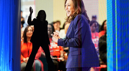 Vice President Kamala Harris, walking left, waves as she arrives to speak during the American Federation of Teachers' 88th national convention, Thursday, July 25, 2024, in Houston. (AP Photo/Tony Gutierrez)