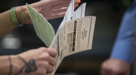 FILE - Poll workers sort out ballots at the Kenosha Municipal building on Election Day, Nov. 3, 2020, in Kenosha, Wis. A judge refused Thursday, Aug. 1, 2024, hold his ruling allowing disabled people in Wisconsin to be emailed absentee ballots. (AP Photo/Wong Maye-E, File)