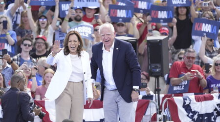 Democratic presidential nominee Vice President Kamala Harris is welcomed by Democratic vice presidential nominee Minnesota Gov. Tim Walz, before she delivers remarks at a campaign event, Wednesday, Aug. 7, 2024, in Eau Claire, Wisc. (AP Photo/Charles Rex Arbogast)