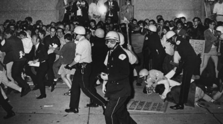 FILE - Chicago Police attempt to disperse demonstrators outside the Conrad Hilton, Democratic National Convention headquarters, Aug. 29, 1968, in Chicago. (AP Photo/Michael Boyer, File)