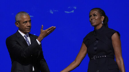 Former President Barack Obama hugs former first lady Michelle Obama as he is introduced during the Democratic National Convention Tuesday, Aug. 20, 2024, in Chicago. (AP Photo/Brynn Anderson)