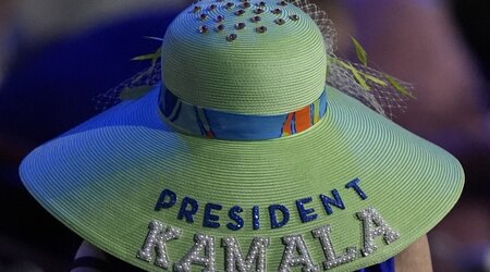 A woman wears a Kamala Harris hat during the Democratic National Convention Wednesday, Aug. 21, 2024, in Chicago. (AP Photo/Charles Rex Arbogast)