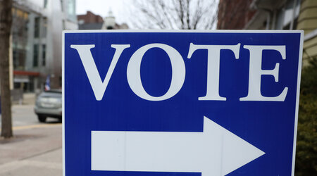 A sign directs voters outside a polling place near the University of Wisconsin-Madison campus on April 4, 2023. (Drake White-Bergey / Wisconsin Watch)