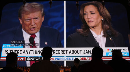 People watch the presidential debate between Republican presidential nominee former President Donald Trump and Democratic presidential nominee Vice President Kamala Harris, Tuesday, Sept. 10, 2024, at the Gipsy Las Vegas in Las Vegas. (AP Photo/John Locher)