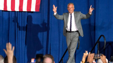 Former Independent candidate for president Robert F. Kennedy, Jr. waves to the crowd as he arrives on stage prior to speaking at a campaign event for Republican presidential nominee former President Donald Trump, Saturday, Sept. 14, 2024, in Glendale, Ariz. (AP Photo/Ross D. Franklin)