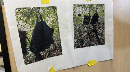 Photos that show an AK-47 rifle, a backpack and a Go-Pro camera on a fence outside Trump International Golf Club taken after an apparent assassination attempt of Republican presidential candidate former President Donald Trump, are displayed during a news conference at the Palm Beach County Main Library, Sunday. Sept. 15, 2024, in West Palm Beach, Fla. (AP Photo/Stephany Matat)