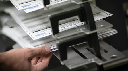 FILE - Poll workers sort out early and absentee ballots at the Kenosha Municipal building on Election Day, in Kenosha, Wis., Nov. 3, 2020. (AP Photo/Wong Maye-E, File)