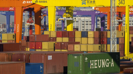 FILE - Shipping containers are stacked at a port in Tianjin, China, Monday, Jan. 16, 2023. (AP Photo/Mark Schiefelbein, File)