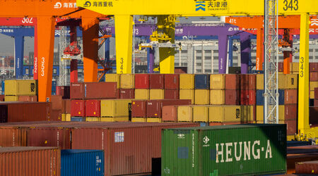 FILE - Shipping containers are stacked at a port in Tianjin, China, Monday, Jan. 16, 2023. (AP Photo/Mark Schiefelbein, File)