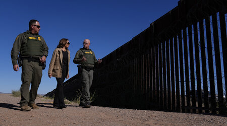 Democratic presidential nominee Vice President Kamala Harris talks with John Modlin, the chief patrol agent for the Tucson Sector of the U.S. Border Patrol, right, and Blaine Bennett, the U.S. Border Patrol Douglas Station border patrol agent in charge, as she visits the U.S. border with Mexico in Douglas, Ariz., Friday, Sept. 27, 2024. (AP Photo/Carolyn Kaster)