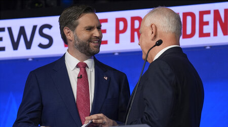 Republican vice presidential nominee Sen. JD Vance, R-Ohio, talks with Democratic vice presidential candidate Minnesota Gov. Tim Walz after the vice presidential debate hosted by CBS News Tuesday, Oct. 1, 2024, in New York. (AP Photo/Matt Rourke)