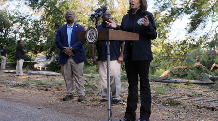 Democratic presidential nominee Vice President Kamala Harris speaks as she tours an area impacted by Hurricane Helene in Augusta, Ga., Wednesday, Oct. 2, 2024, as Augusta Mayor Garnett Johnson, left, and FEMA deputy administrator Erik Hooks listen. (AP Photo/Carolyn Kaster)