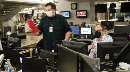 FILE - With the Florida results in his hand, Deputy Managing Editor David Scott, left, who helps oversee The Associated Press' coverage of elections, calls that race in favor of President Donald Trump on Election night at the Washington bureau of the AP, Wednesday, Nov. 4, 2020. (AP Photo/Pablo Martinez Monsivais, File)