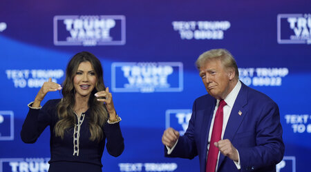 Republican presidential nominee former President Donald Trump and South Dakota Gov. Kristi Noem dance to the song &quot;Y.M.C.A.&quot; at a campaign town hall at the Greater Philadelphia Expo Center &amp; Fairgrounds, Monday, Oct. 14, 2024, in Oaks, Pa. (AP Photo/Matt Rourke)