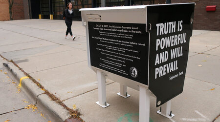 FILE - A former absentee ballot drop box has been transformed into a pro-democracy piece of art in Madison, Wis., shown Oct. 25, 2022. (AP Photo/Scott Bauer, File)