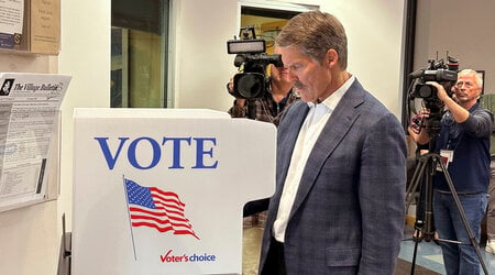 Republican U.S. Senate candidate Eric Hovde casts his ballot at the Village Hall in Shorewood Hills, Wis., Tuesday, Oct. 22, 2024, the first day of early in-person absentee voting in the battleground state. (AP Photo/Todd Richmond)