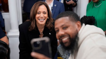 Democratic presidential nominee Vice President Kamala Harris takes a selfie with a patron at a campaign stop at Famous 4th Street Delicatessen in Philadelphia, Wednesday, Oct. 23, 2024. (AP Photo/Matt Rourke)