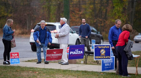 People arrive at polling place to vote, Tuesday, Nov. 5, 2024, in Springfield, Pa. (AP Photo/Matt Slocum)