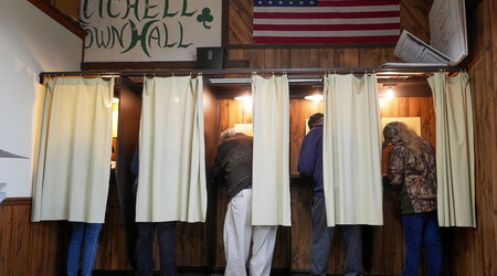 Voters mark their ballots at a polling place, Tuesday, Nov. 5, 2024, in Mitchell, Wis. (AP Photo/Morry Gash)