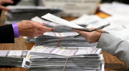 Election workers process ballots for the 2024 General Election, Tuesday, Nov. 5, 2024, in Milwaukee. (AP Photo/Morry Gash)