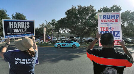 FILE - Supporters of democratic presidential nominee Vice President Kamala Harris and Republican presidential nominee former President Donald Trump campaign outside a polling place, Nov. 5, 2024, in McAllen, Texas.(Joel Martinez/The Monitor via AP, File)/The Monitor via AP)