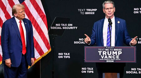 FILE - Republican presidential nominee former President Donald Trump, left, listens as investor Scott Bessent speaks on the economy in Asheville, N.C., Aug. 14, 2024. (AP Photo/Matt Kelley, File)