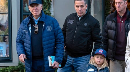 President Joe Biden accompanied by his son Hunter Biden and his grandson Beau leave a book store as they walk in downtown Nantucket Mass., Friday, Nov. 29, 2024. (AP Photo/Jose Luis Magana)