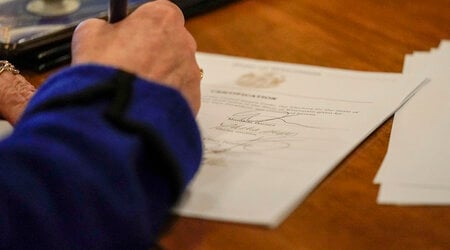 FILE - Members of Wisconsin's Electoral College cast their votes at the state Capitol in Madison, Wis., Monday, Dec. 14, 2020. (AP Photo/Morry Gash, Pool, File)