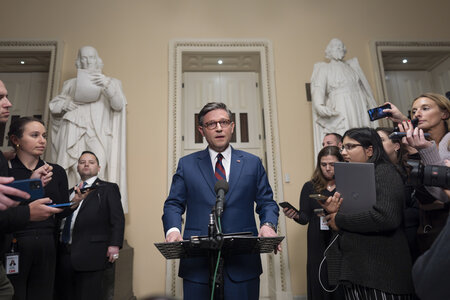 Speaker of the House Mike Johnson, R-La., talks briefly to reporters just before a vote on an interim spending bill to prevent a government shutdown, at the Capitol in Washington, Thursday, Dec. 19, 2024. The vote failed to pass. (AP Photo/J. Scott Applewhite)