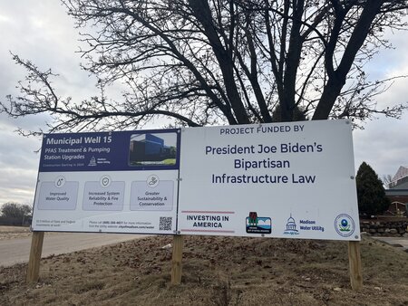 A sign in Madison, Wisconsin touting a municipal well project funding by President Biden’s bipartisan infrastructure law. | Photo by Ruth Conniff/Wisconsin Examiner