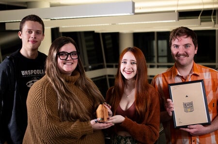 Adobe Express Play team members (left to right) Cole Finn, Ella Johnson, Ava Hedlund and Doran Exline, with their Wood Pencil award. Photo provided by Cole Finn.