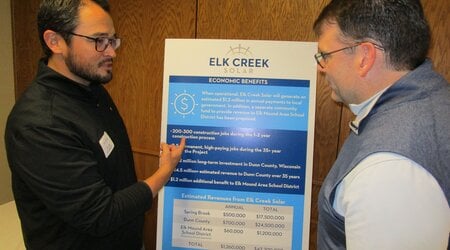 Robert Shanklin, right, president and CEO of TED Renewables and Dylan Stickney, project developer for Elk Creek Solar, were at the open house to answer questions from the community at the Spring Brook town hall.