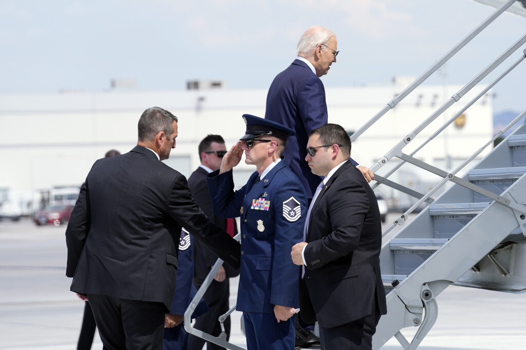 President Joe Biden walks up the steps of Air Force One at Harry Reid International Airport in Las Vegas, Wednesday, July 17, 2024. Biden has tested positive for the coronavirus, according to a speaker at the UnidosUS annual conference broadcast on the White House's YouTube channel. (AP Photo/Susan Walsh)