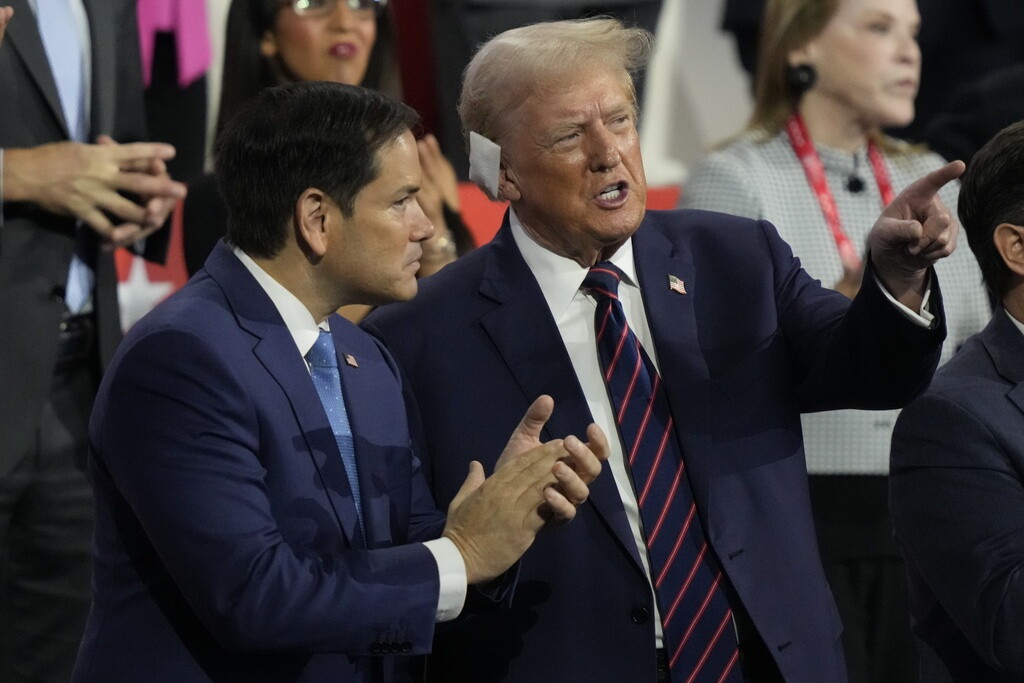 Republican presidential candidate former President Donald Trump talks to Sen. Marco Rubio during the Republican National Convention Wednesday, July 17, 2024, in Milwaukee. (AP Photo/Charles Rex Arbogast)