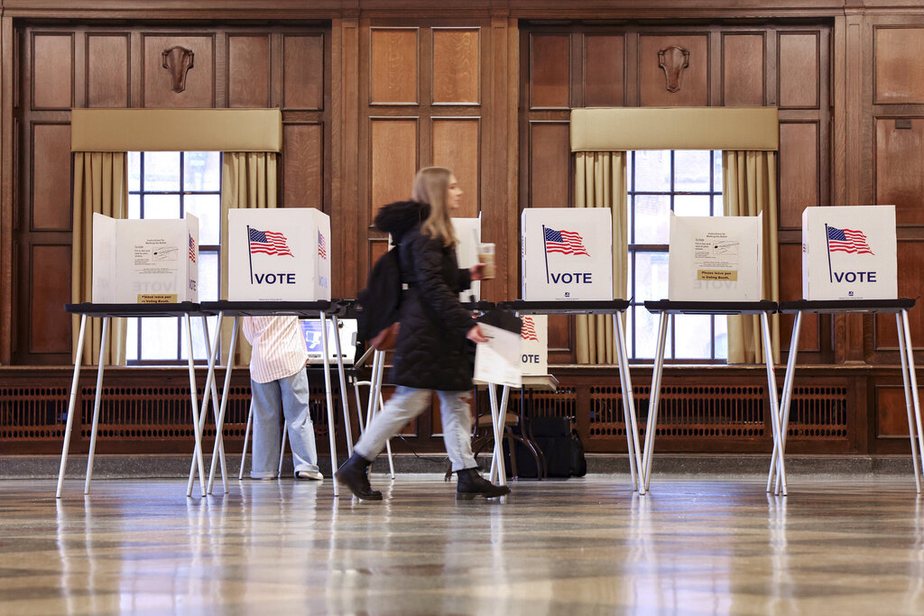 FILE - Voters in the state's presidential primary election register their votes at UW-Madison's Memorial Union in Madison, Wis., April 2, 2024. (AP Photo/John Hart, Wisconsin State Journal, File)