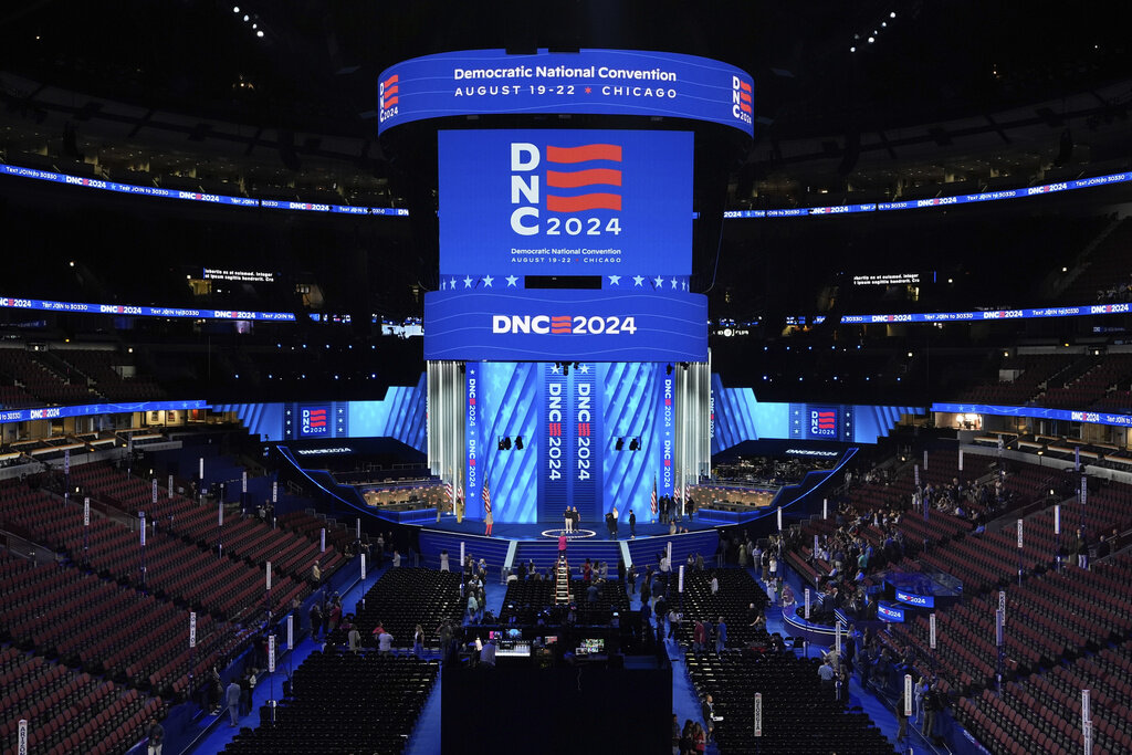 Workers prepare the convention floor at United Center before the Democratic National Convention Sunday, Aug. 18, 2024, in Chicago. (AP Photo/Paul Sancya)