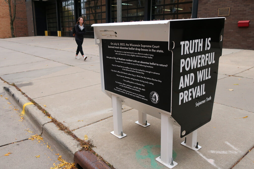 FILE - A former absentee ballot drop box has been transformed into a pro-democracy piece of art in Madison, Wis., shown Oct. 25, 2022. (AP Photo/Scott Bauer, File)