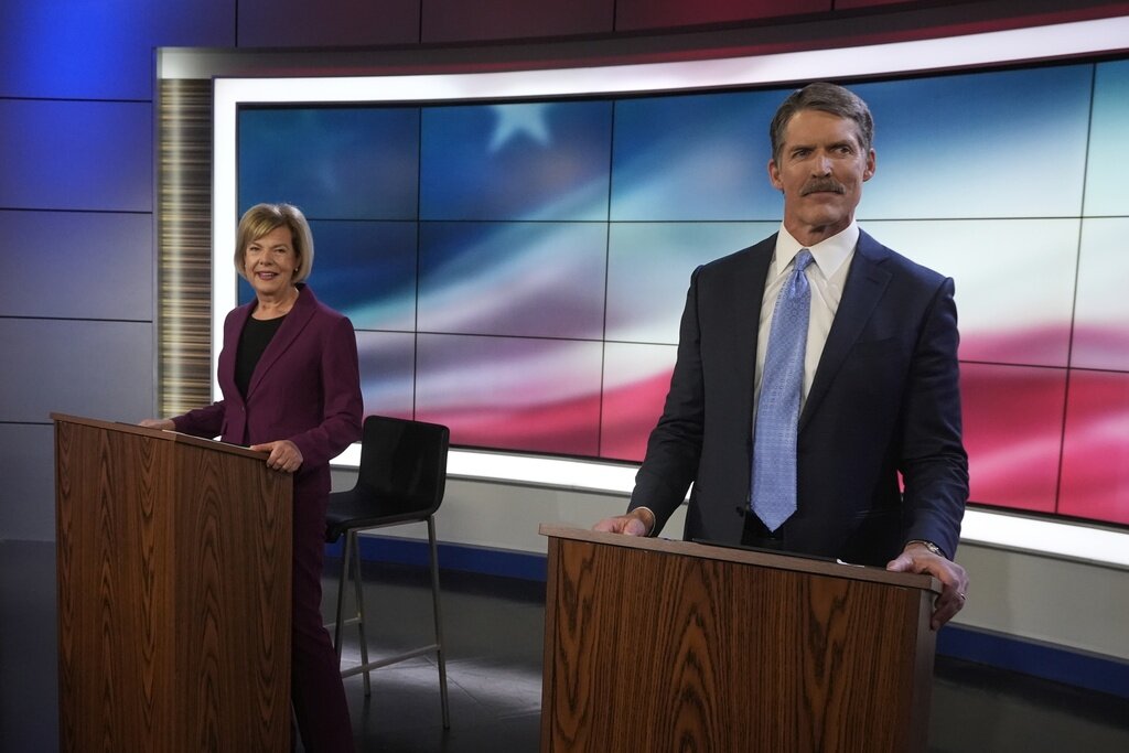 Wisconsin Senate candidates Republican Eric Hovde and Democratic U.S. Sen. Tammy Baldwin are seen before a televised debate Friday, Oct. 18, 2024, in Madison, Wis. (AP Photo/Morry Gash)