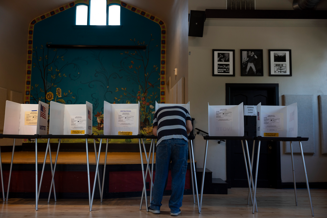 A voter casts a ballot during the primary election Aug. 13, 2024, at the Wil-Mar Neighborhood Center in Madison, Wis. (Joe Timmerman / Wisconsin Watch)