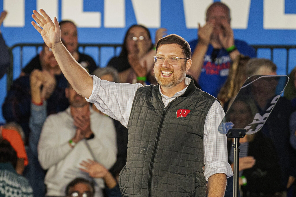 FILE - Ben Wikler, chair of the Democratic Party of Wisconsin, waves to the crowd at a campaign event, Nov. 1, 2024, in Little Chute, Wis. (AP Photo/Andy Manis, File)