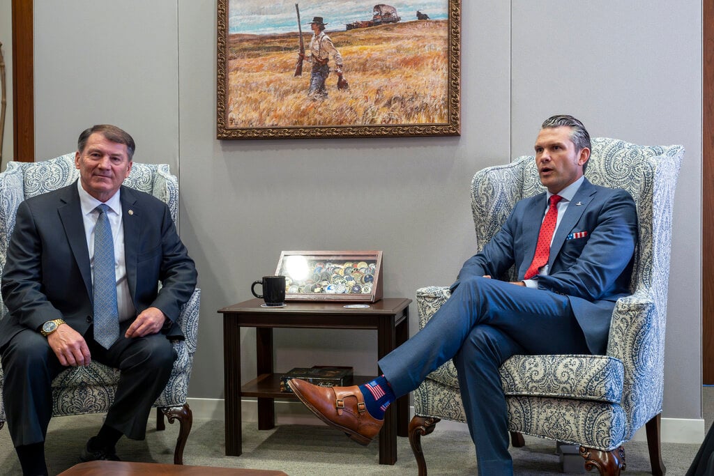 Sen. Mike Rounds, R-S.D., a member of the Senate Armed Services Committee, left, meets with Pete Hegseth, President-elect Donald Trump's nominee to be defense secretary, at the Capitol in Washington, Thursday, Dec. 5, 2024. (AP Photo/J. Scott Applewhite)