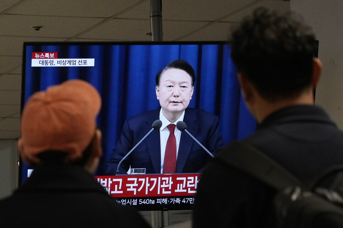 FILE - People watch a TV screen showing South Korean President Yoon Suk Yeol's televised briefing at a bus terminal in Seoul, South Korea, Dec. 3, 2024. (AP Photo/Ahn Young-joon, File)