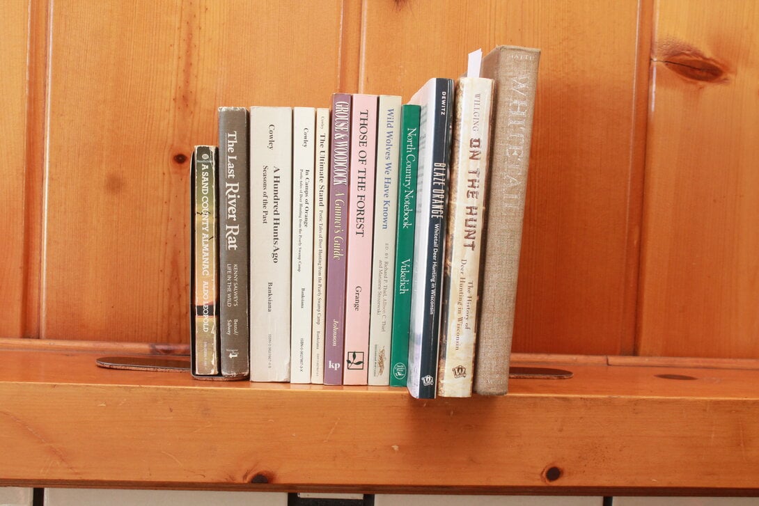 books on a fire place mantle